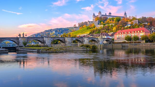 View of bridge over river and old town in Germany