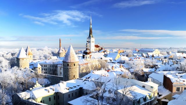 Drone shot of old town in Estonia with snow