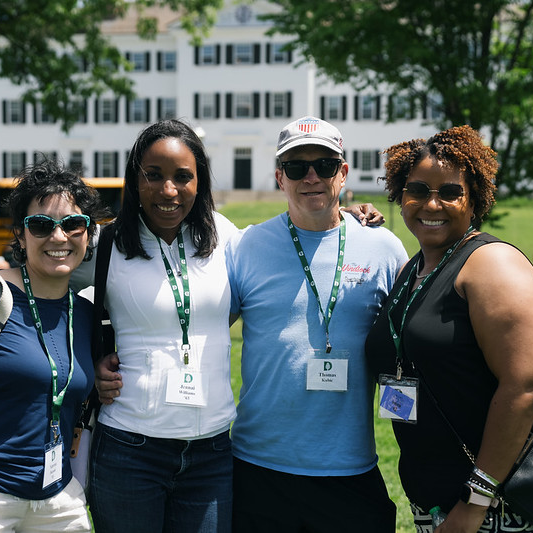 A group of people posing for a photo at Reunions.
