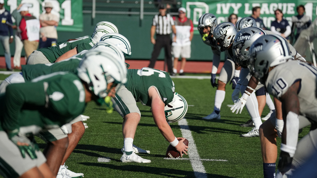 A photo of the Dartmouth football team lined up before the snap.