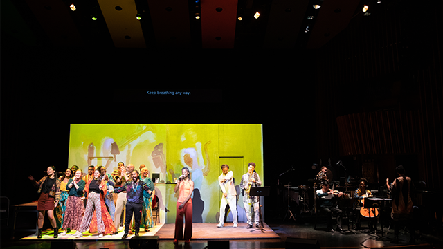 Performers on stage during a performance of Ritual of Breath