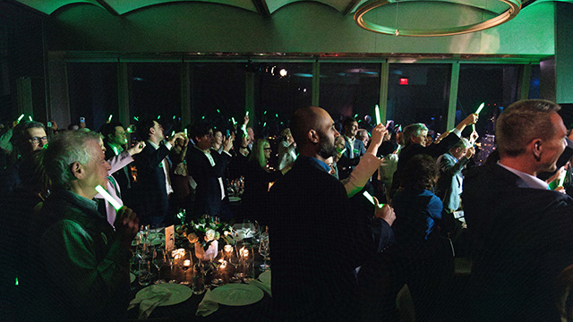 A group of people standing and celebrating at the Entrepreneurs Hall of Fame event